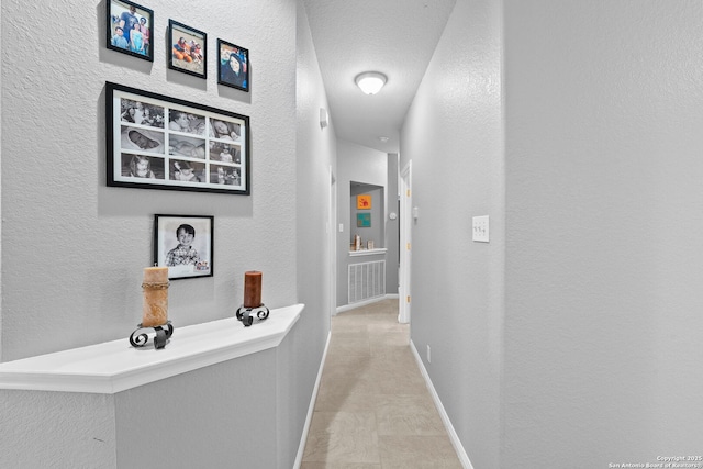 22841 San Saba Blf, San Antonio, TX 78258 - hallway with baseboards and a textured wall