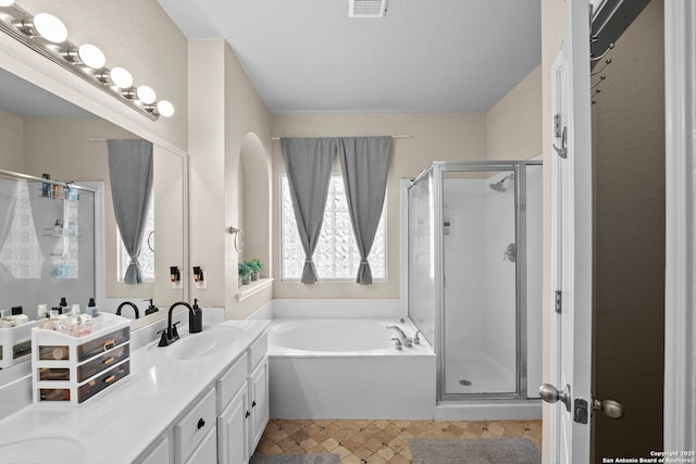 22841 San Saba Blf, San Antonio, TX 78258 - bathroom with a stall shower, a garden tub, and vanity