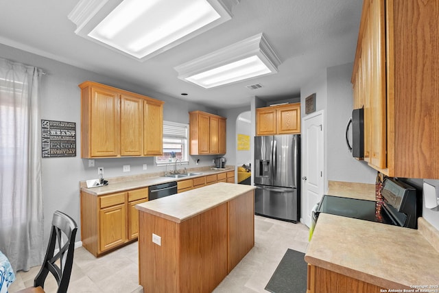 22841 San Saba Blf, San Antonio, TX 78258 - kitchen with appliances with stainless steel finishes, a sink, a center island, and light countertops