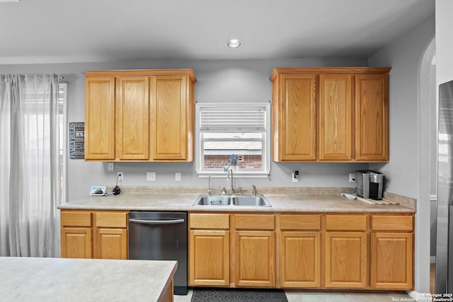 22841 San Saba Blf, San Antonio, TX 78258 - kitchen with dishwasher, a sink, light countertops, and arched walkways