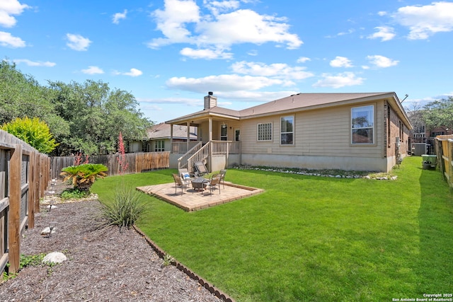 22841 San Saba Blf, San Antonio, TX 78258 - back of house featuring a patio area, a chimney, and central air condition unit