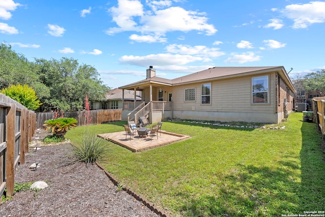 22841 San Saba Blf, San Antonio, TX 78258 - back of house with a patio area, a chimney, and central AC