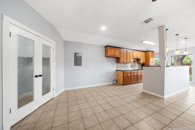 8255 Misty Willow, San Antonio, TX 78250 - kitchen featuring electric panel, a sink, french doors, brown cabinets, and recessed lighting