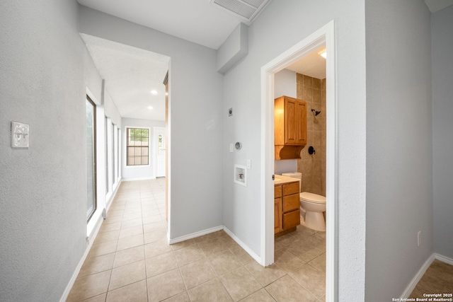 8255 Misty Willow, San Antonio, TX 78250 - corridor with light tile patterned floors and baseboards
