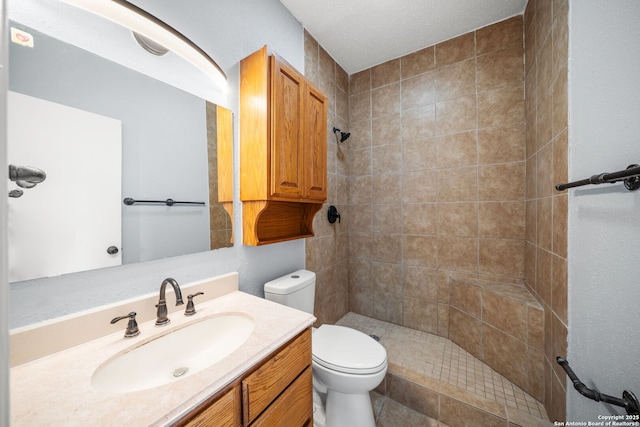 8255 Misty Willow, San Antonio, TX 78250 - bathroom with tiled shower, toilet, and vanity