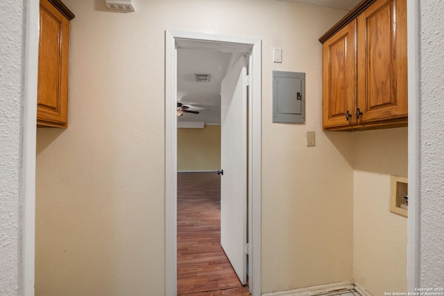 8255 Misty Willow, San Antonio, TX 78250 - washroom featuring electric panel, wood finished floors, and a ceiling fan