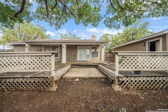 8255 Misty Willow, San Antonio, TX 78250 - back of property with a deck, a chimney, and french doors