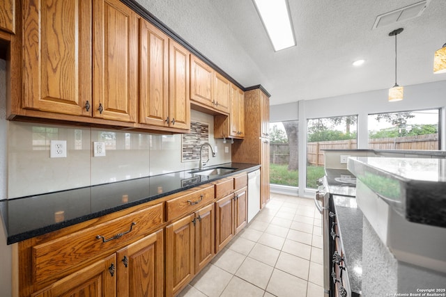 8255 Misty Willow, San Antonio, TX 78250 - kitchen featuring a sink, white dishwasher, light tile patterned floors, a textured ceiling, and brown cabinets