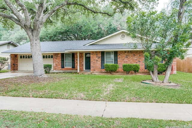 3123 Manila Dr, San Antonio, TX 78217 - ranch-style house with a garage, roof with shingles, concrete driveway, and brick siding