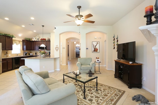 26940 Rustic Brk, San Antonio, TX 78261 - living room featuring arched walkways, a ceiling fan, lofted ceiling, baseboards, and recessed lighting