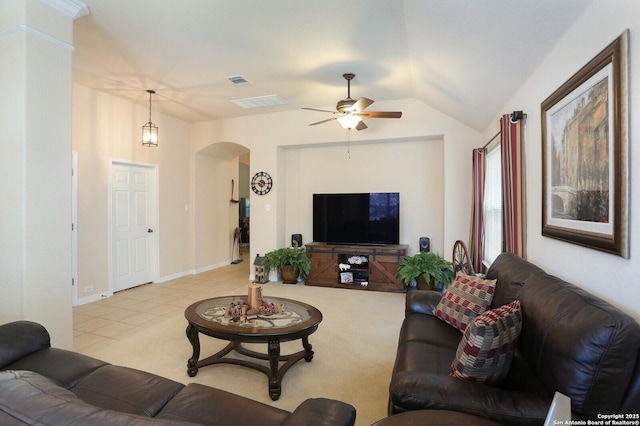26940 Rustic Brk, San Antonio, TX 78261 - living room featuring arched walkways, a ceiling fan, vaulted ceiling, light tile patterned floors, and baseboards