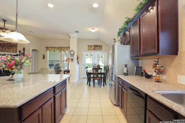 26940 Rustic Brk, San Antonio, TX 78261 - kitchen featuring black dishwasher, light tile patterned floors, tasteful backsplash, hanging light fixtures, and light stone counters