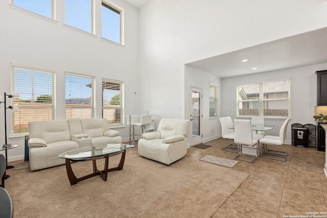8515 Desert Cv, San Antonio, TX 78254 - living area featuring plenty of natural light, a high ceiling, and baseboards