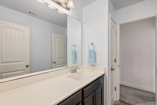 8515 Desert Cv, San Antonio, TX 78254 - bathroom with vanity and baseboards
