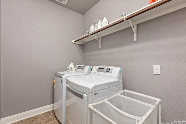 8515 Desert Cv, San Antonio, TX 78254 - laundry room with washing machine and dryer and baseboards