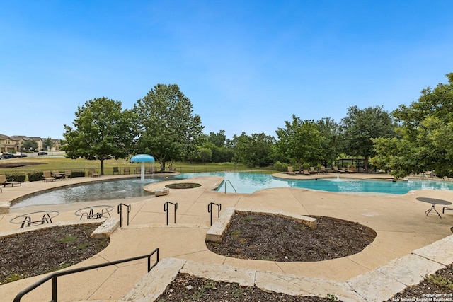 8515 Desert Cv, San Antonio, TX 78254 - community pool with a patio