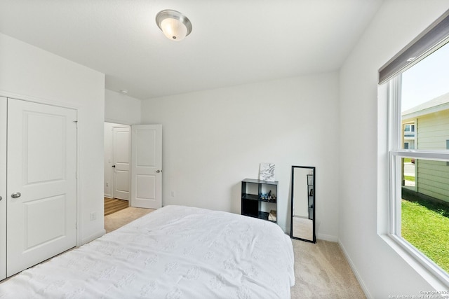 14407 Elkhorn Crst, San Antonio, TX 78253 - bedroom with multiple windows, light colored carpet, and baseboards
