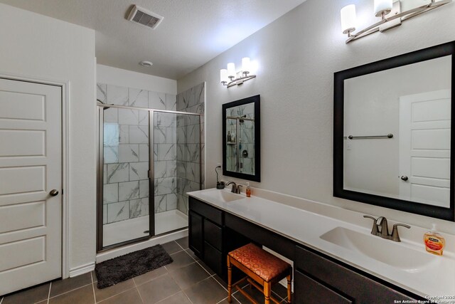 26323 Gibraltar, Boerne, TX 78015 - full bath with a stall shower, tile patterned floors, and double vanity