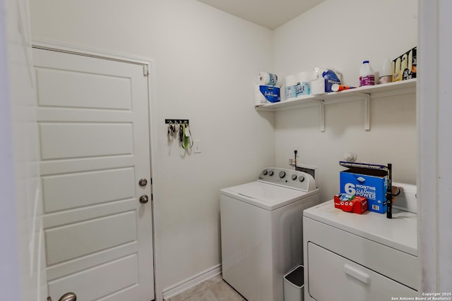26323 Gibraltar, Boerne, TX 78015 - washroom featuring washing machine and dryer, baseboards, and light tile patterned flooring