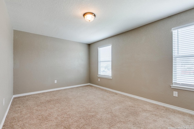 14802 Achilles Dr, San Antonio, TX 78245 - carpeted empty room with baseboards