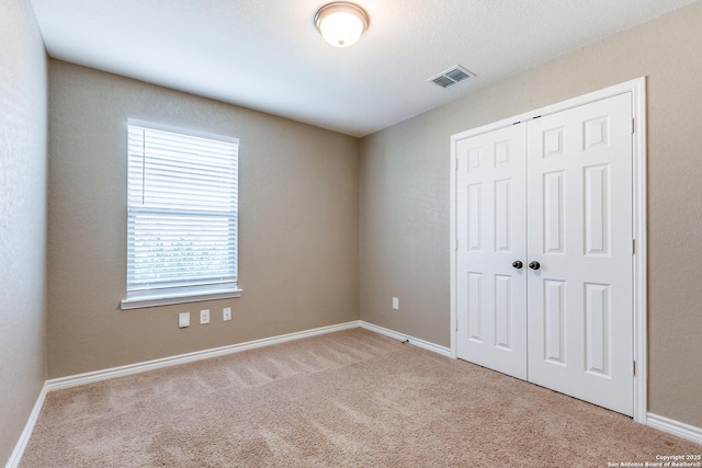 14802 Achilles Dr, San Antonio, TX 78245 - unfurnished bedroom featuring carpet floors, a closet, and baseboards