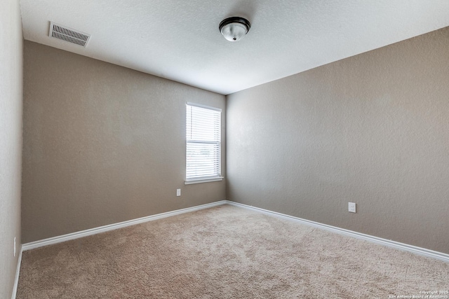 14802 Achilles Dr, San Antonio, TX 78245 - spare room featuring carpet flooring and baseboards
