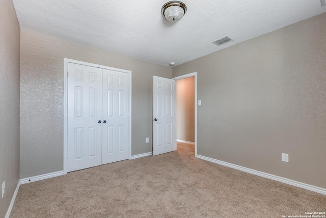 14802 Achilles Dr, San Antonio, TX 78245 - unfurnished bedroom with carpet floors, baseboards, and a closet