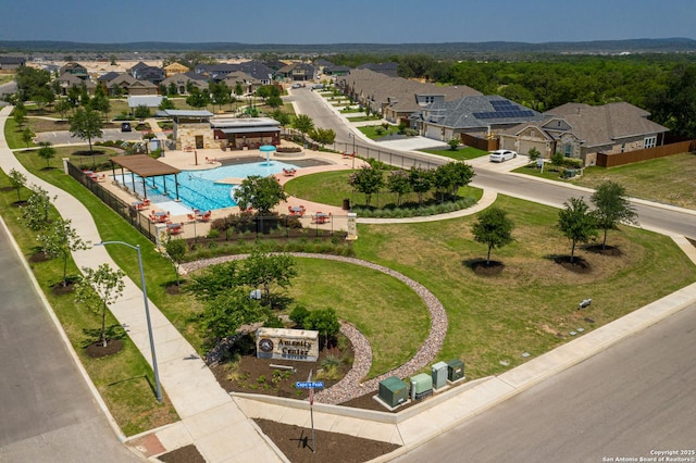 aerial perspective of suburban area featuring a pool area