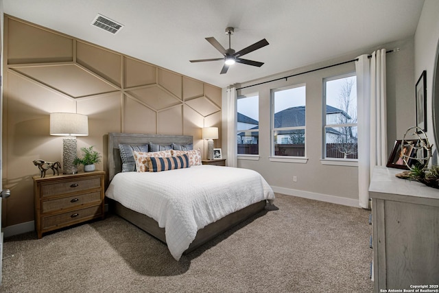 bedroom with baseboards, light carpet, and ceiling fan