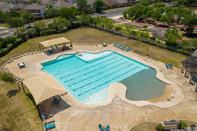 community pool featuring fence, a gazebo, and a patio