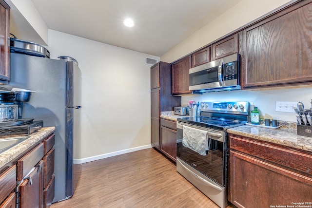 255 E Rampart Unit 401, San Antonio, TX 78216 - kitchen featuring stainless steel appliances, light wood finished floors, baseboards, dark brown cabinets, and recessed lighting