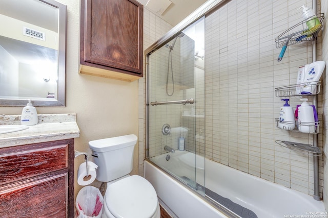 255 E Rampart Unit 401, San Antonio, TX 78216 - full bathroom featuring vanity, toilet, and shower / bath combination with glass door