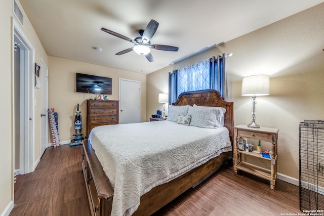 255 E Rampart Unit 401, San Antonio, TX 78216 - bedroom with baseboards, wood finished floors, and a ceiling fan