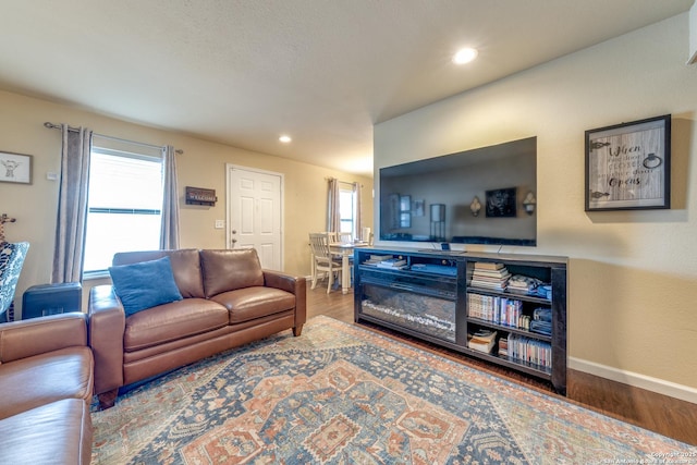 255 E Rampart Unit 401, San Antonio, TX 78216 - living area with wood finished floors, plenty of natural light, baseboards, and recessed lighting