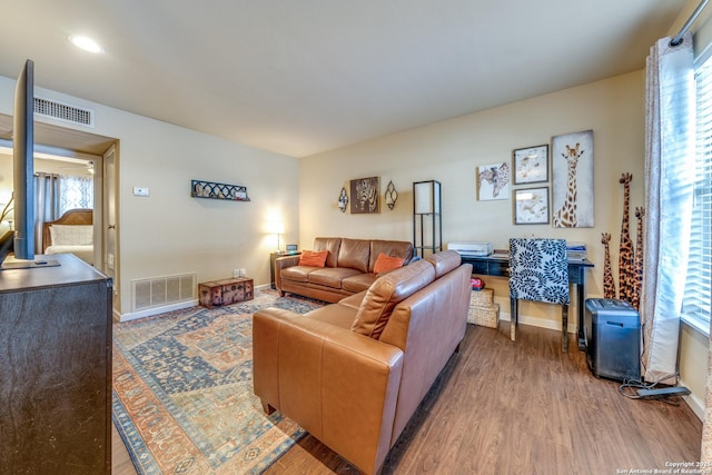255 E Rampart Unit 401, San Antonio, TX 78216 - living area with wood finished floors and baseboards