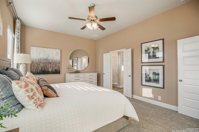 178 Jax Loop, San Antonio, TX 78253 - bedroom with light colored carpet, baseboards, ensuite bathroom, and a ceiling fan