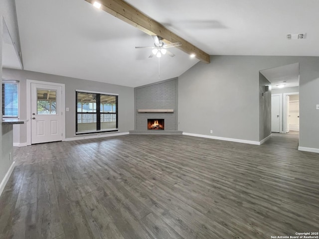 unfurnished living room featuring a ceiling fan, dark wood finished floors, baseboards, and a fireplace