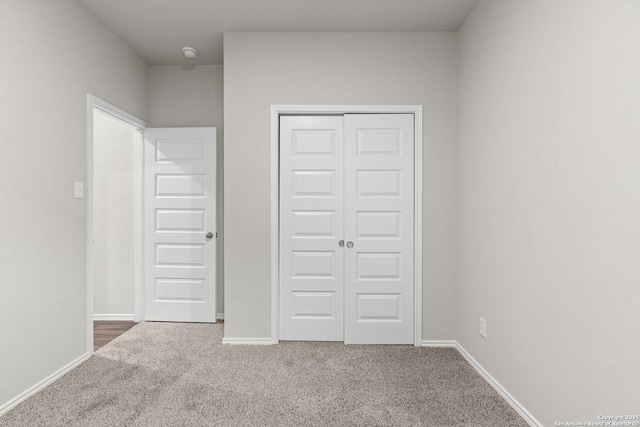 9318 Graze Br, San Antonio, TX 78211 - unfurnished bedroom featuring carpet floors, a closet, and baseboards