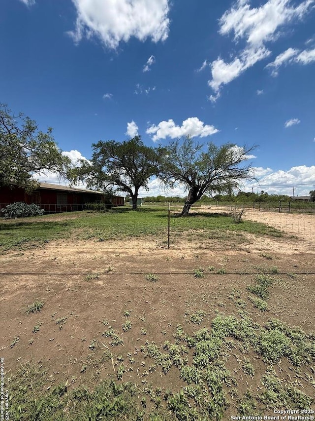 view of yard featuring a view of rural / pastoral area