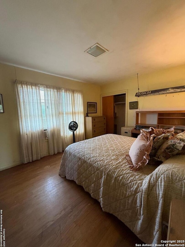 bedroom with wood finished floors