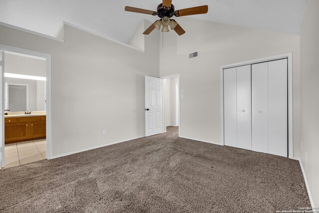 11819 Rousseau, San Antonio, TX 78251 - unfurnished bedroom with light colored carpet, a closet, a sink, high vaulted ceiling, and ensuite bathroom