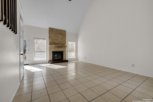 11819 Rousseau, San Antonio, TX 78251 - unfurnished living room featuring high vaulted ceiling, light tile patterned floors, and a fireplace