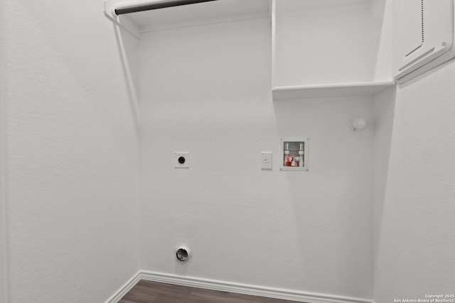 9410 Graze Land, San Antonio, TX 78211 - laundry area featuring hookup for a washing machine, electric dryer hookup, dark wood-style floors, baseboards, and hookup for a gas dryer