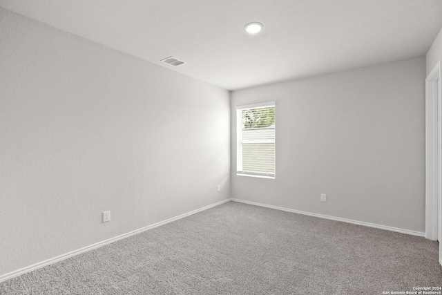 carpeted spare room with baseboards and recessed lighting