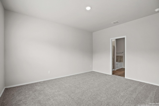 unfurnished room with carpet flooring, baseboards, and recessed lighting
