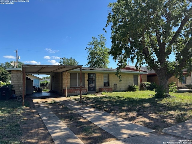 227 E Villaret Blvd, San Antonio, TX 78221 - ranch-style house featuring brick siding, concrete driveway, an attached carport, and a front yard