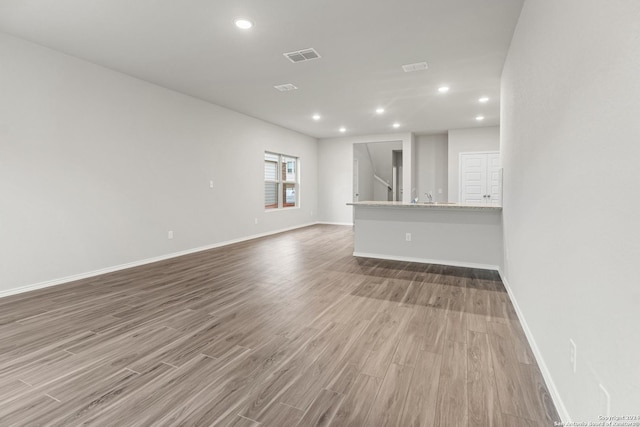 9322 Graze Br, San Antonio, TX 78211 - empty room with wood finished floors, baseboards, and recessed lighting