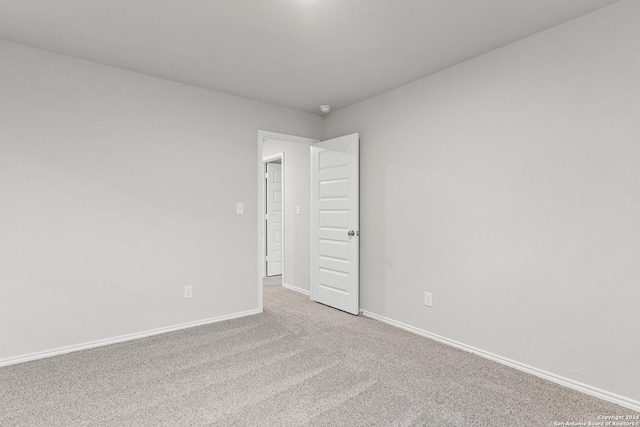 9322 Graze Br, San Antonio, TX 78211 - spare room with baseboards and carpet floors