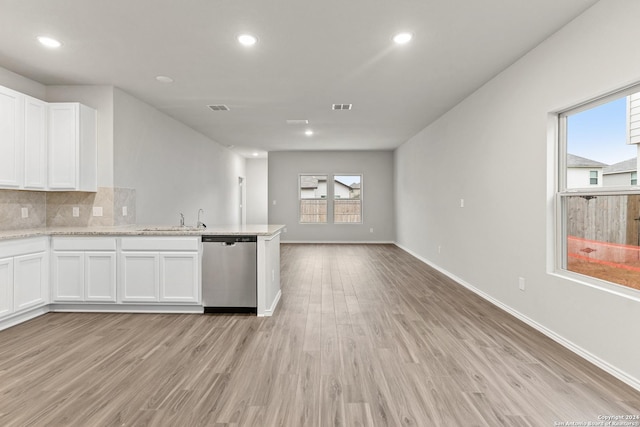 9322 Graze Br, San Antonio, TX 78211 - kitchen featuring dishwasher, white cabinets, light wood-style floors, open floor plan, and a peninsula