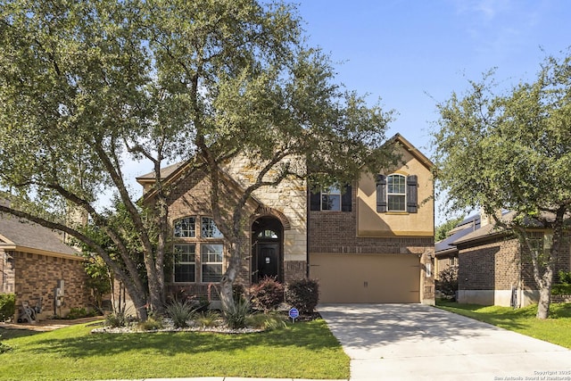 11734 Violet Cv, San Antonio, TX 78253 - view of front of property with an attached garage, driveway, a front yard, stone siding, and brick siding